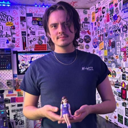 Miles Robbins posted a picture of himself in his workroom. 